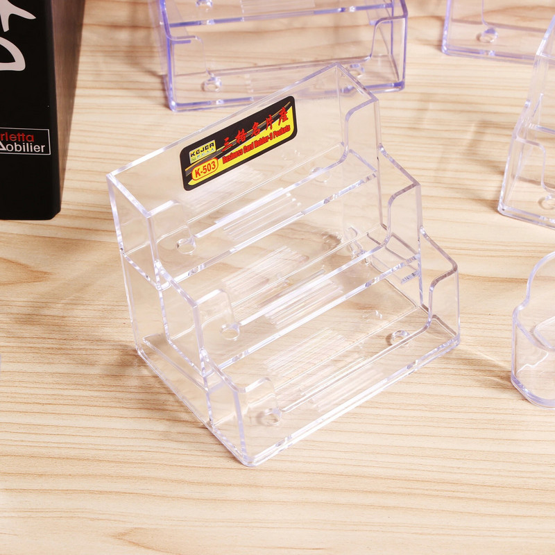 Daudzslāņu caurspīdīgs displeja statīvs galddatora vizītkaršu kaste Īpaša biroja vizītkaršu turētāja rakstāmgalda uzglabāšanas kaste