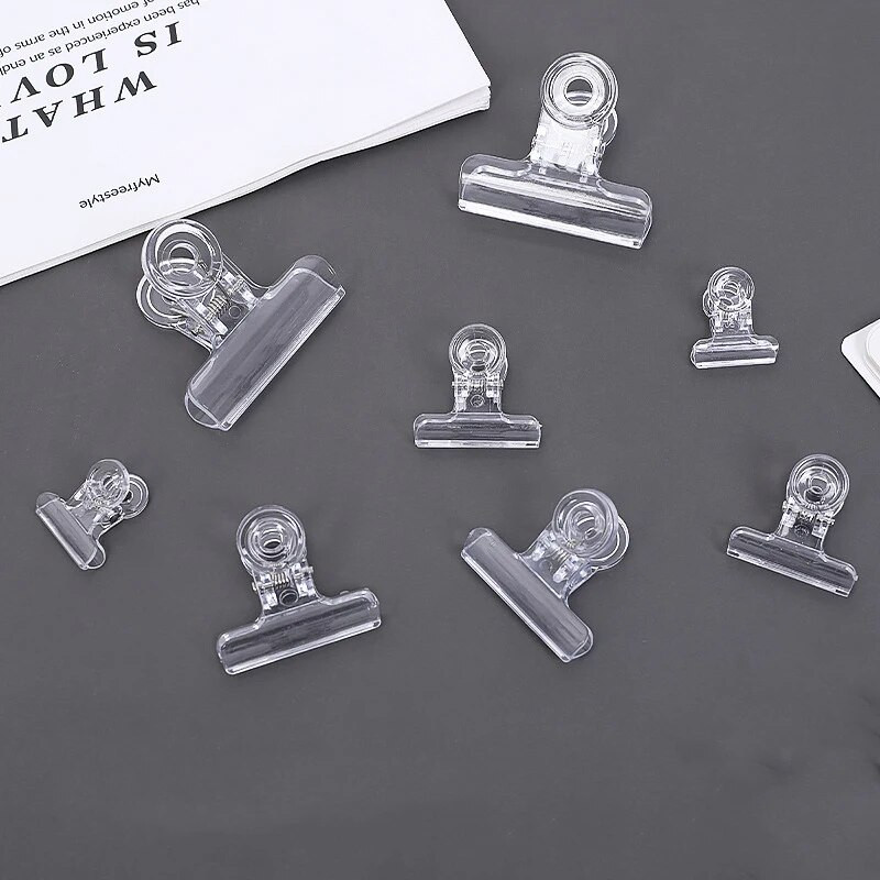 4 gab./komplekts Caurspīdīga iesiešanas mapju klipsis Biroja piederumi Rēķinu papīrs Garās astes saspraudes Dokumenti Failu rādītājs Lapas turētājs Skavas skola