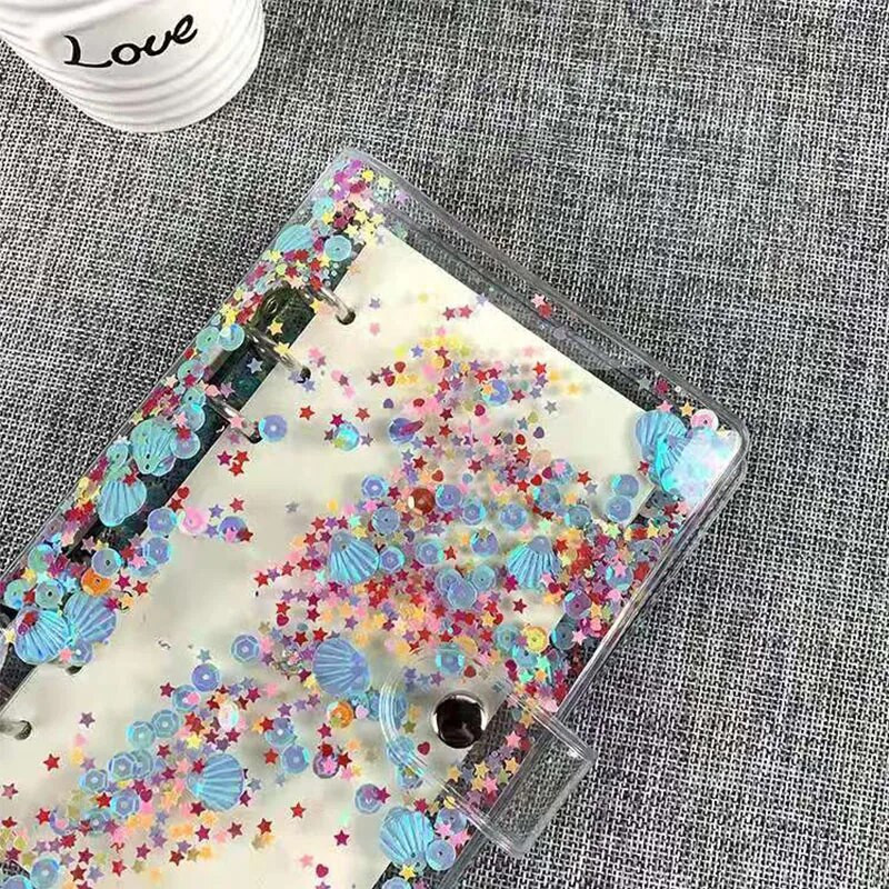 Caurspīdīga PVC mape, grāmatu vāks, atsperu iesiešana ar vaļējām lapām A6 izmērā