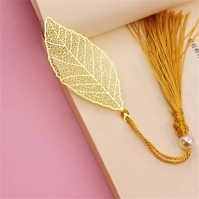 Kullavärvi lehekujulised järjehoidjad tutiga Mood Õõnes lootose kujuga raamatumärgid õpilaste kirjatarbed Kooli kontoritarbed Kingitused