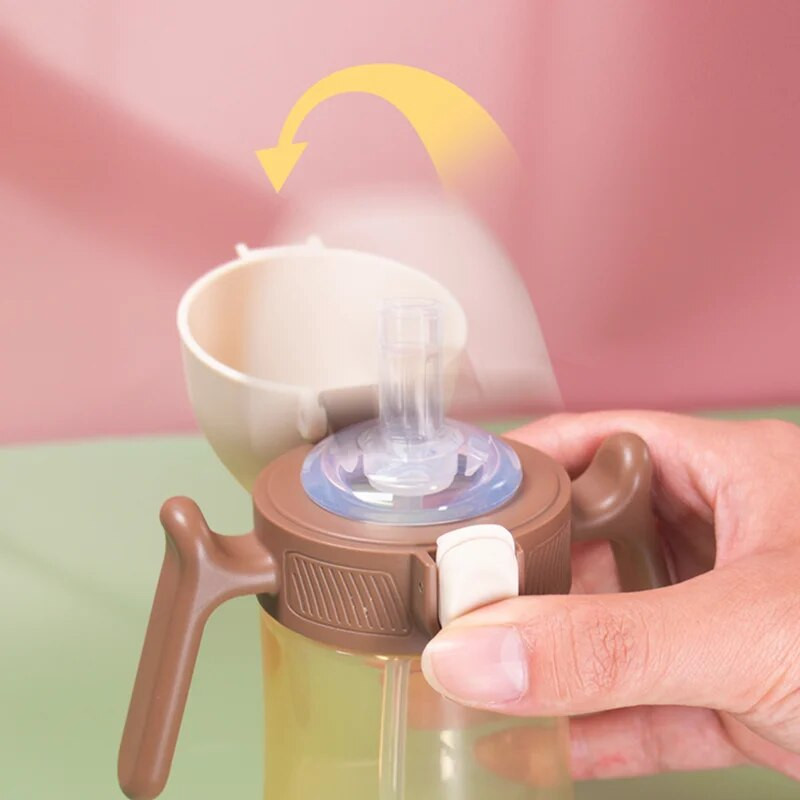 1 gab. Bērnu ūdens pudele Pārnēsājami bērnu krūzes Gravitācijas bumba ar rokturi 240ml Noplūdes necaurlaidīgs elastīgs vāks bērnu treniņu ūdens kauss