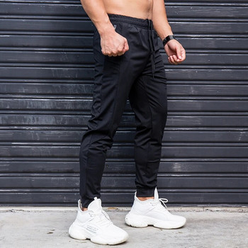 Еластични мъжки панталони за бягане Ежедневни спортни панталони с джобове с ципове Тренировъчни джогинг Фитнес панталони Спортни панталони за фитнес тренировка
