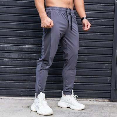 Elasticitate Pantaloni de alergare pentru bărbați Pantaloni de sport casual cu buzunare cu fermoar Antrenament Jogging Pantaloni de fitness Pantaloni de sport pentru antrenament de sală