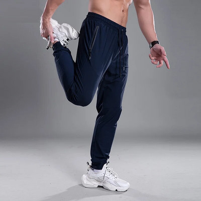 Pantaloni pentru bărbați cu uscare rapidă Pantaloni sport pentru alergare cu buzunare cu fermoar Pantaloni de antrenament pentru jogging Pantaloni casual de fitness