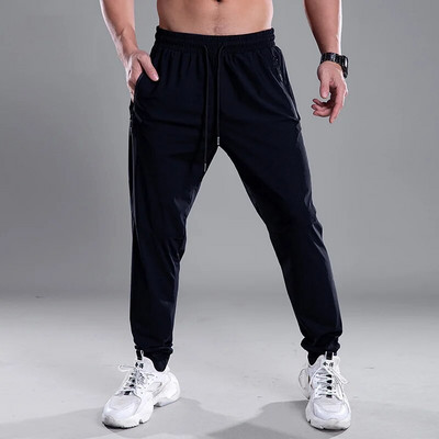 Pantaloni pentru bărbați cu uscare rapidă Pantaloni sport pentru alergare cu buzunare cu fermoar Pantaloni de antrenament pentru jogging Pantaloni casual de fitness