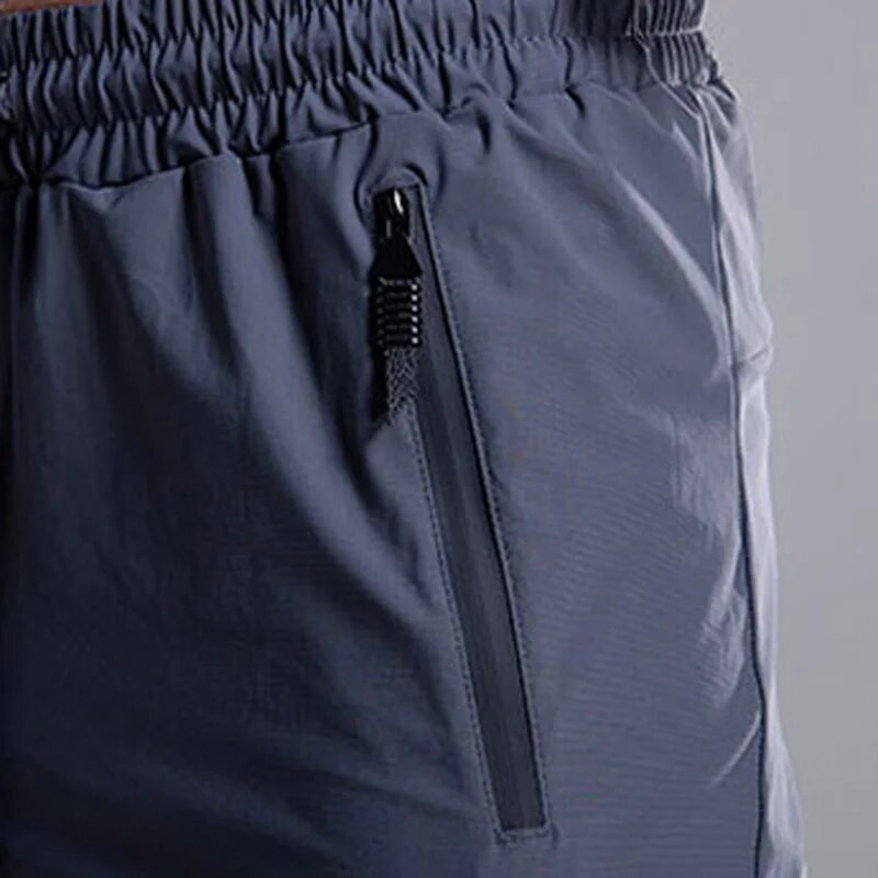 Ανδρικό παντελόνι Quick Dry για τρέξιμο με τσέπες με φερμουάρ Εκπαίδευση Φούτερ για τζόκινγκ Παντελόνι καθημερινής γυμναστικής