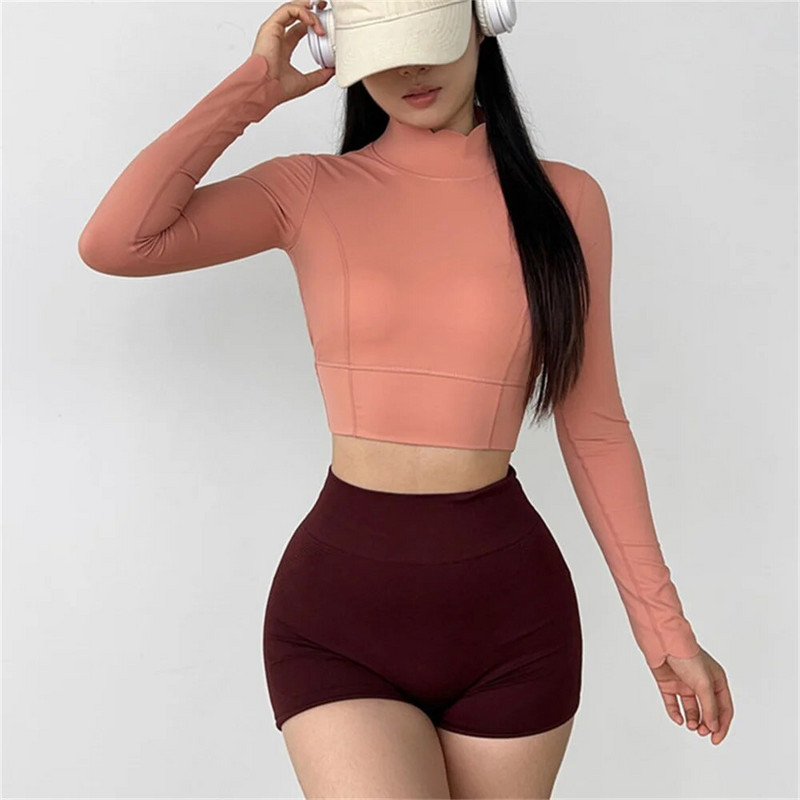 2023 Pad Nylon με ψηλό λαιμό Laser Laser πουκάμισο γιόγκα Γυναικεία εξώπλατη προπόνηση Crop Top Fitness Gym Μακρυμάνικα πουκάμισα για τρέξιμο