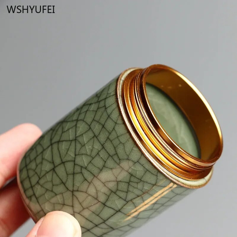 Celadoni metallist keeratava korgiga miniteepurk väike mugav reisihotell väike teekann keraamiline puuder, rouge huulepulga hoiupaak