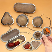 Ovaalse südame sfääri kujuga vürtside maitseaine teesõel koos ketiga roostevabast terasest võrgust palli tee kohvifilter korv infusioonitööriistad