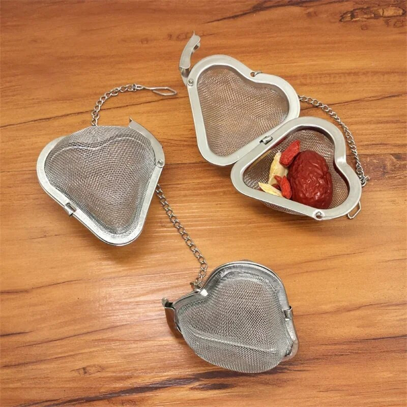 Ovaalse südame sfääri kujuga vürtside maitseaine teesõel koos ketiga roostevabast terasest võrgust palli tee kohvifilter korv infusioonitööriistad