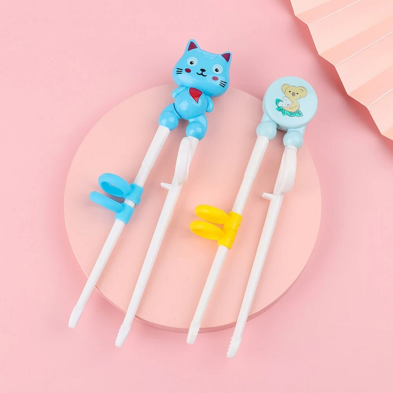 1 db rajzfilm pálcika Gyerekek edzés evés pálcika Ismerje meg a pálcikákat a helyes használatban. Aranyos kölyök gyakorlat pálcika műanyag