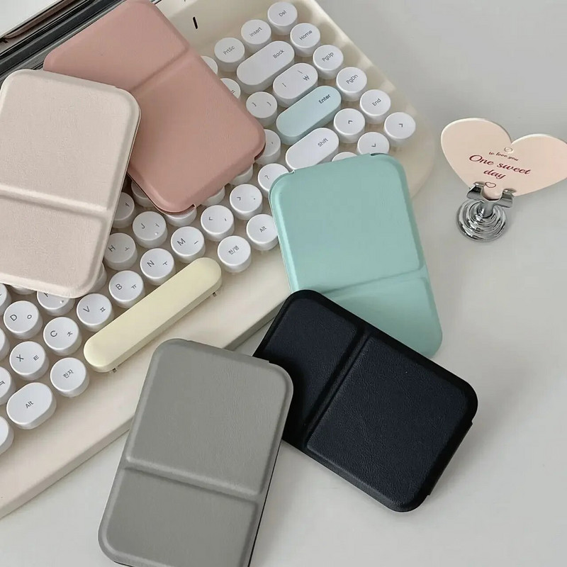 Καθρέφτης μακιγιάζ επιτραπέζιου καθρέφτη μονόχρωμο PU δέρμα Απλό φορητό φορητό καθρέφτη μακιγιάζ χειρός Πτυσσόμενος μαθητής συμπαγής χαριτωμένος καθρέφτης τσέπης