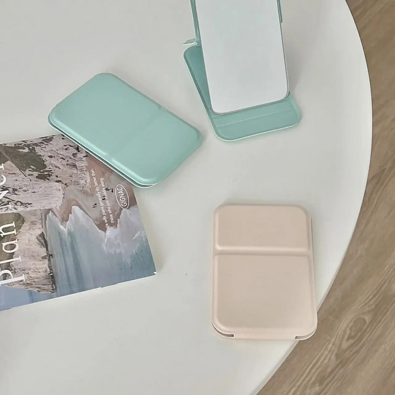 Καθρέφτης μακιγιάζ επιτραπέζιου καθρέφτη μονόχρωμο PU δέρμα Απλό φορητό φορητό καθρέφτη μακιγιάζ χειρός Πτυσσόμενος μαθητής συμπαγής χαριτωμένος καθρέφτης τσέπης