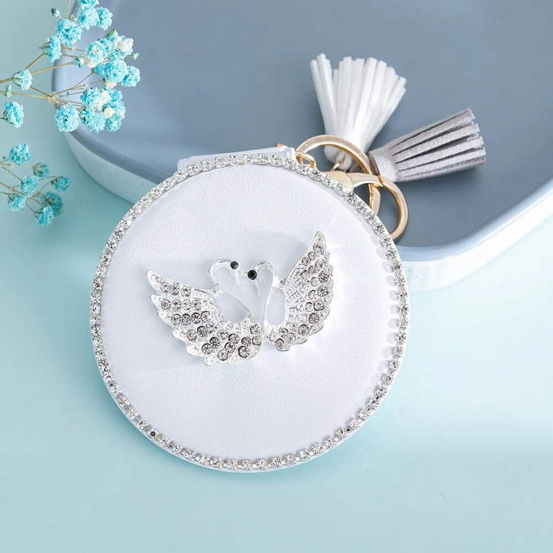 Kétoldalas kompakt kozmetikai tükör mini kerek PU sminktükör Aranyos hattyúbojt hordozható sminktükör kulcstartó táska dísz