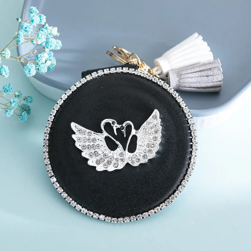 Kétoldalas kompakt kozmetikai tükör mini kerek PU sminktükör Aranyos hattyúbojt hordozható sminktükör kulcstartó táska dísz