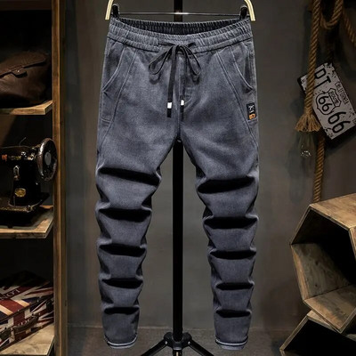 Jar/jeseň 2022 Nové džínsy so sťahovacou šnúrkou a elastickým pásom, pánske úzke nohavice, kórejská móda, ležérne nohavice, háremové džínsy s vreckami