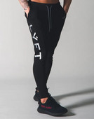 Pantaloni de fitness pentru bărbați de primăvară și toamnă Pantaloni casual sport Pantaloni lungi Pantaloni în nouă puncte de culoare uni Pantaloni largi pentru alergare