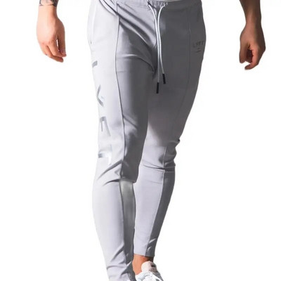 Pantaloni de fitness pentru bărbați de primăvară și toamnă Pantaloni casual sport Pantaloni lungi Pantaloni în nouă puncte de culoare uni Pantaloni largi pentru alergare