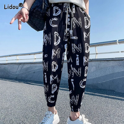 Pánske oblečenie 2023 Módne voľné elastické pásy Jednoduchosť Pekné potlačené pruhované jarné letné tenké pohodlné ležérne nohavice