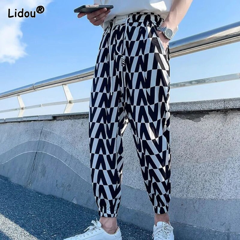 Pánske oblečenie 2023 Módne voľné elastické pásy Jednoduchosť Pekné potlačené pruhované jarné letné tenké pohodlné ležérne nohavice