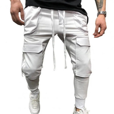 Pánske nohavice s viacerými vreckami a elastickým pásom, rebrované členkové jednofarebné sťahovacie šnúrky, pracovné nohavice