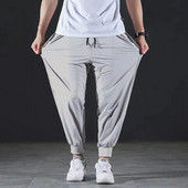 Pantaloni casual din mătase de gheață cu uscare rapidă de vară Pantaloni ultra-subțiri, elastici, în nouă puncte, pentru bărbați, largi, solizi, respirabili.