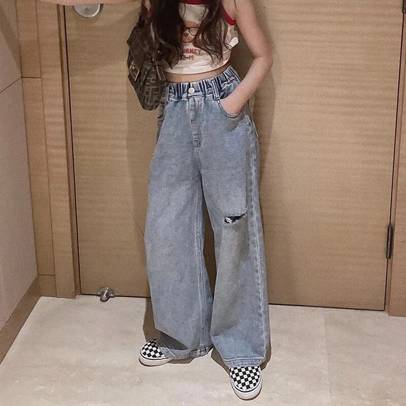 Dievčenské džínsy, kórejská verzia, roztrhané ležérne nohavice, dievčenská móda v západnom štýle, široké nohavice, jarné a jesenné detské roztrhané džínsy