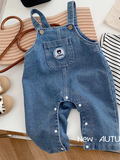 2023 Kórejské batoľacie dievčatká Jarné jesenné džínsy Nášivky s kreslenými hračkami Voľné traky s vreckámi Bavlnené džínsové nohavice pre dojčatá