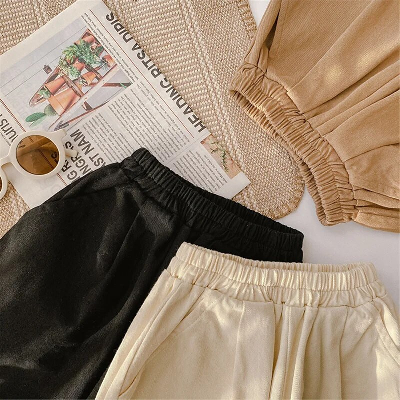Korea stiilis kevadised poiste ja tüdrukute soliidsed vabaaja püksid unisex mood vabad püksid lasteriiete jaoks