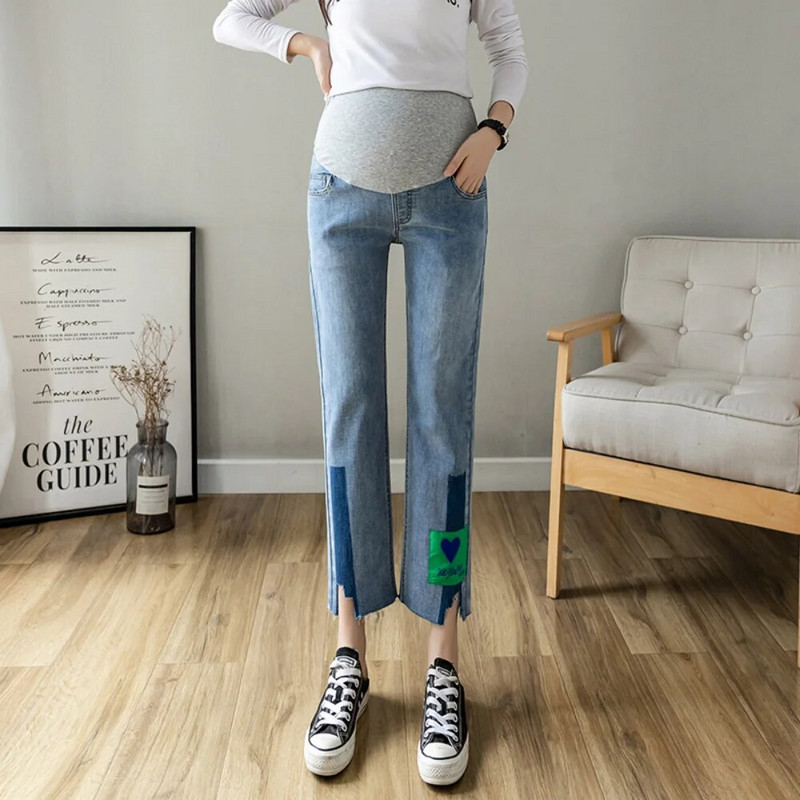 Iš šono suskaldytas džinsas motinystės tiesūs ilgi džinsai plačiomis kojomis laisvos kelnės Drabužiai nėščiosioms Prašmatnus nėštumas Moteriškas kūnas