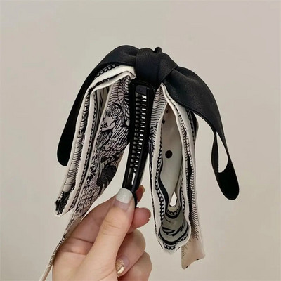 Bowknot masni banán csíptető aranyos koreai stílusú szalagos haj karmos függőleges klip lófarok tartó