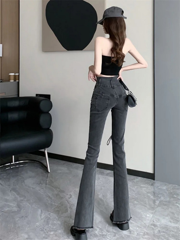 Modne asimetrične podijeljene korejske traperice Harajuku Bandage Ležerne vintage Y2K traper hlače Ulične hlače u trendu 2022.