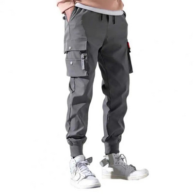 Talie elastică cu înălțime mijlocie Manșete contractabile cu șnur Pantaloni de trening pentru bărbați Cu buzunare multiple Culoare uni Pantaloni cargo casual