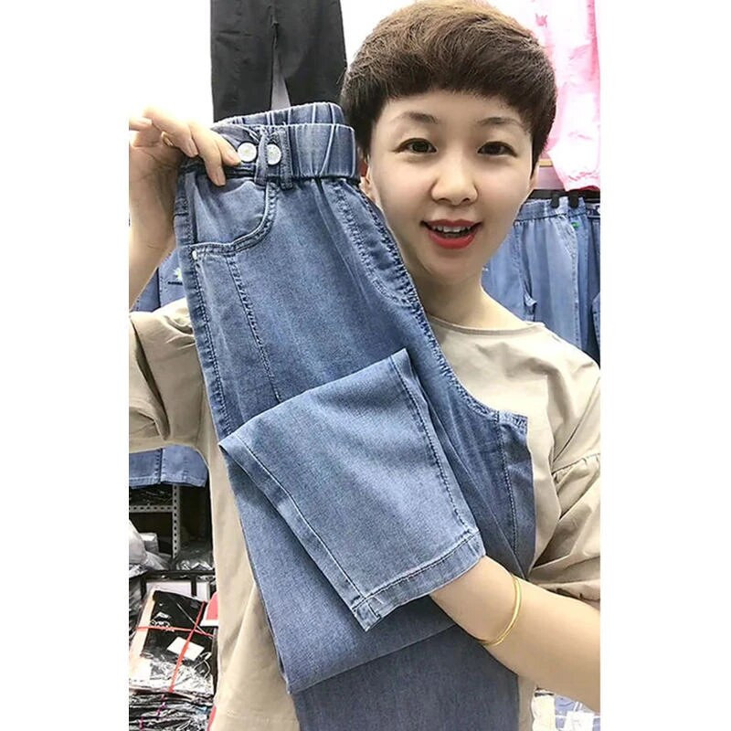 2022 m. vasara Naujoji Korėja mados moterų elastingas juosmuo Laisvos medvilnės džinsinės kelnės Haremas Visiškai suderintos laisvalaikio siuvinėjimo džinsai V959