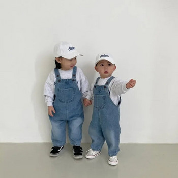 Есен в корейски стил Бебе момиче Момче Свободни гащеризони Кремаво-бели сини дънкови панталони с презрамки Детски модни универсални панталони Ec401