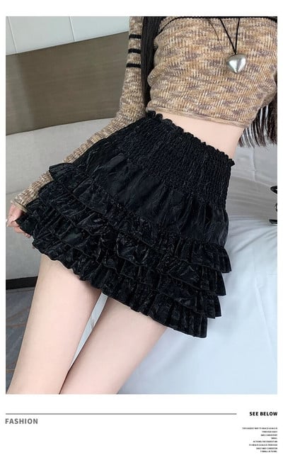 Rudeninis plonas žakardo raukinių kraštų mergina, jaučianti aksominį torto sijoną aukštu juosmeniu