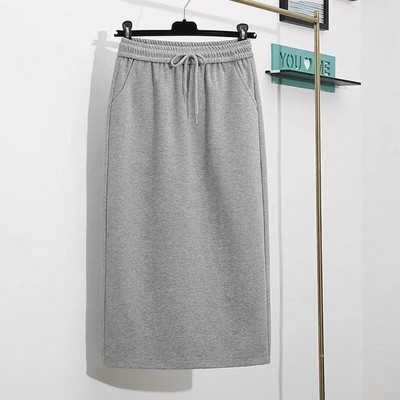 Proljeće i jesen 2023. Jednostavna i moderna svestrana uska ravna polusuknja visokog struka s džepovima na vezanje i pokriva međunožje