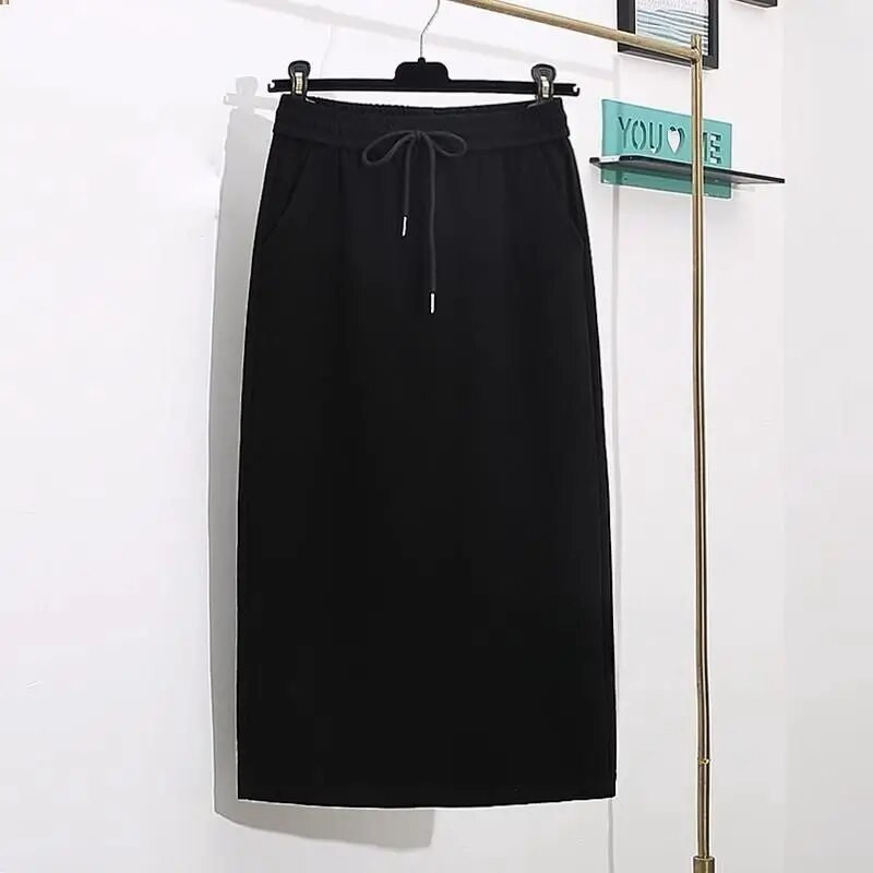 Proljeće i jesen 2023. Jednostavna i moderna svestrana uska ravna polusuknja visokog struka s džepovima na vezanje i pokriva međunožje