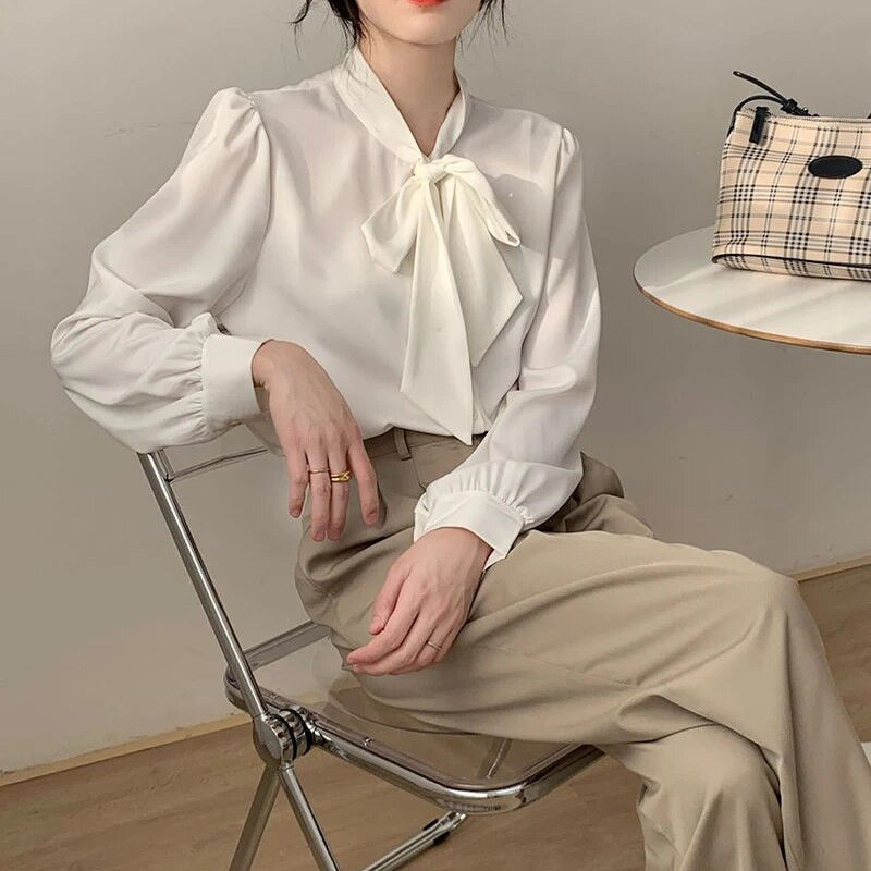 Kevadsuvi naiste elegantsed ja moodsad vibunööbid Sifonki särk Naiste pikkade varrukatega vaba vabaaja Naiste kardiganpluus