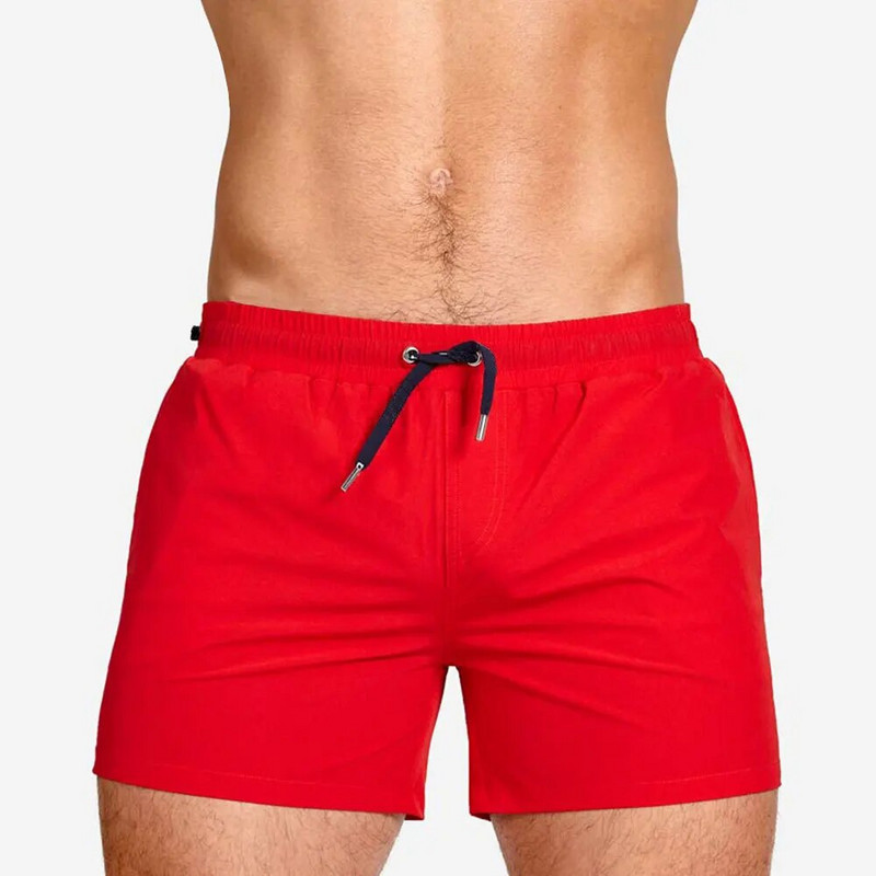 Europska američka moda Jednostavne jednobojne kratke hlače za plažu s tri točke Mrežasta podstava Plivanje Surf Sportske kratke hlače za fitnes Brzo sušenje