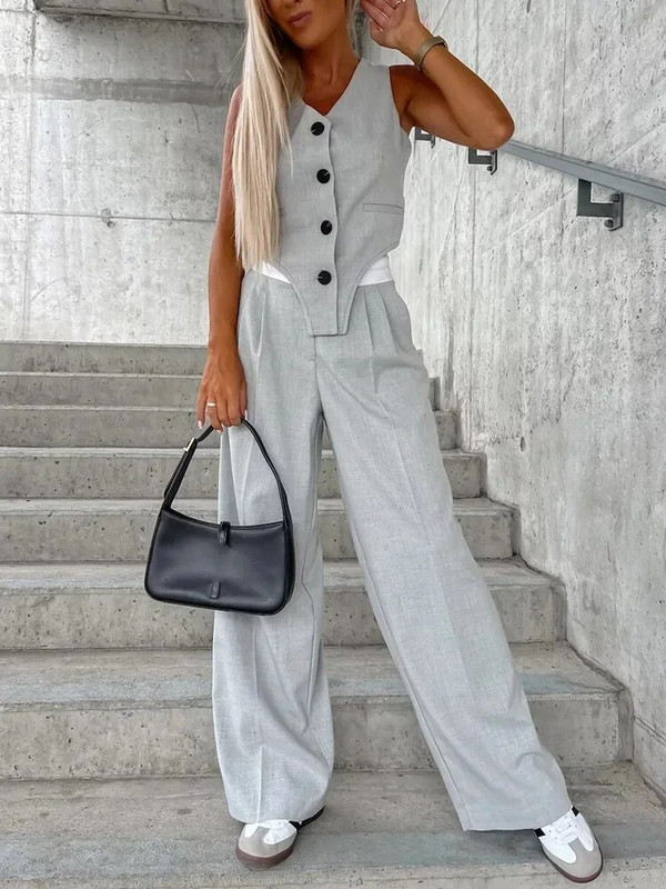 Ljeto-jesen dvodijelni set za žene 2023. Modni prugasti sako bez rukava bez rukava i komplet širokih hlača s naborima za uredsko odijelo