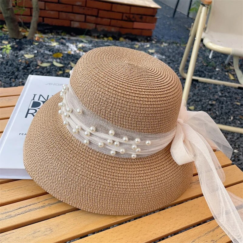 Vintage napernyős sapka női Hepburn stílusú ünnep Elegáns gyöngy masni temperamentum nyári szalmakalap divat anti-UV strandkalap