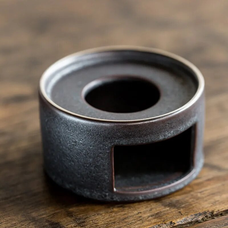 Kompaktiškas keraminis šiltos arbatos viryklės pagrindas gali laikyti įvairius aukštai temperatūrai atsparius puodų izoliacinius daugiafunkcius priedus