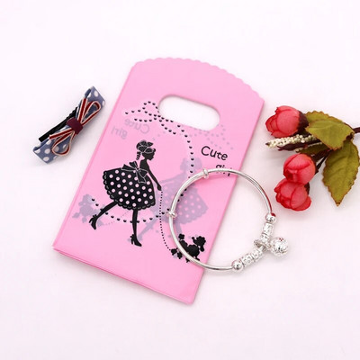 50 db/tétel Multi Designs Kis műanyag zacskó 9x15cm Boutique Ajándéktáska Fogantyúval Szép Charms Fülbevaló Ékszer Csomagoló Táskák