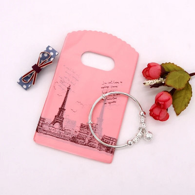 50 db/tétel Multi Designs Kis műanyag zacskó 9x15cm Boutique Ajándéktáska Fogantyúval Szép Charms Fülbevaló Ékszer Csomagoló Táskák