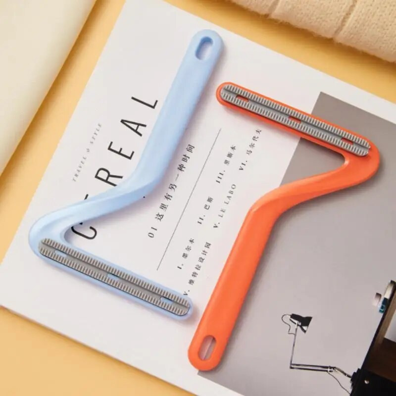 Šunų kačių plaukų šalinimo šepetėlis pašalina naminių gyvūnėlių plaukus.