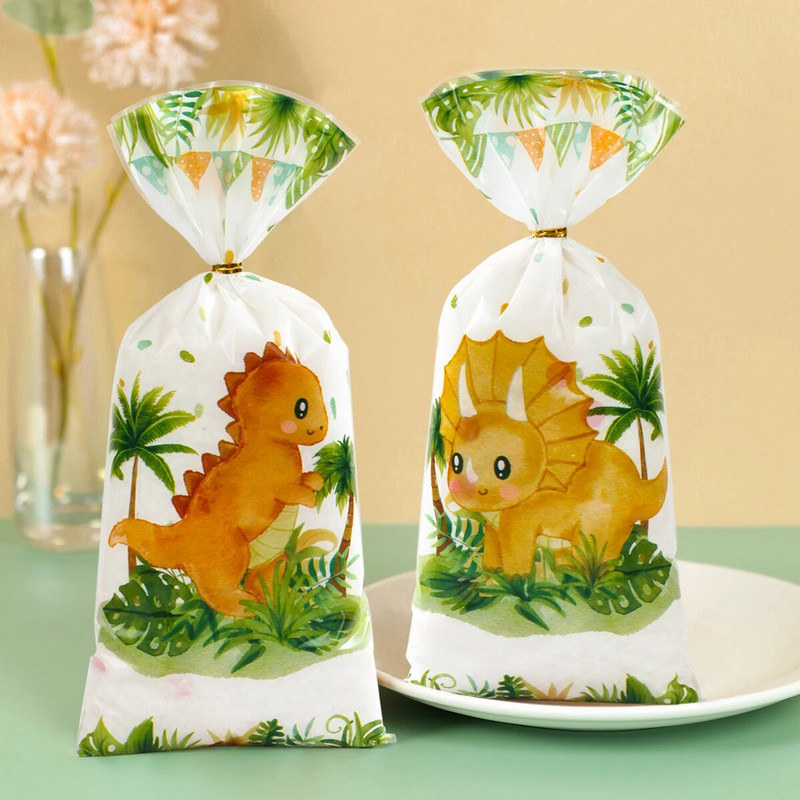 25/50/100db Rajzfilm dinoszaurusz PVC ajándéktasakok cukorka süti csomagoló táska dzsungel dinoszaurusz hableány pillangó születésnapi parti dekoráció