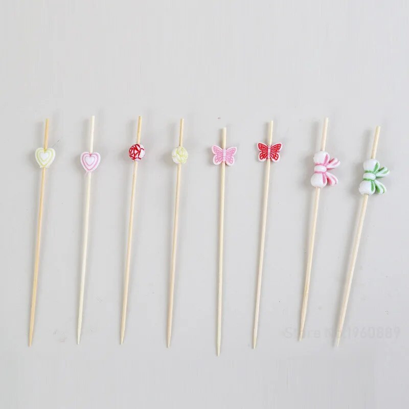 100 db Butterfly eldobható bambusz nyárs Élelmiszer koktél csákány Svédasztalos Gyümölcs Cupcake Villarudak Partiasztal dekorációs kellékek