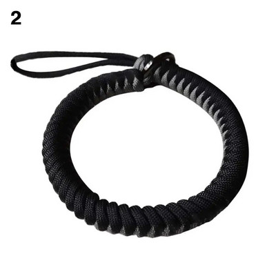 Pretnozaudēšanas kameras plaukstas siksna izturīga izpletņa virve rokas ātri noņemama pārnēsājama dāvanu štrope regulējami āra piederumi