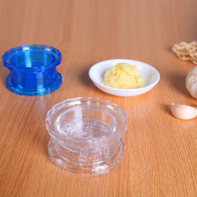 Manuālas griežamās ķiploku spiedes Plastmasas ķiploku smalcinātājs Dārzeņu smalcinātājs Ķiploku dzirnaviņas Kaste Mājas piederumi Virtuves sīkrīki